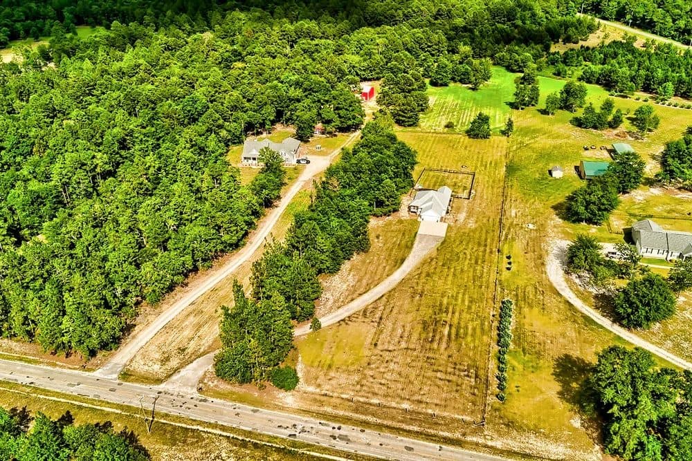 Aerial of large-lot homes and woods in Gilbert, South Carolina