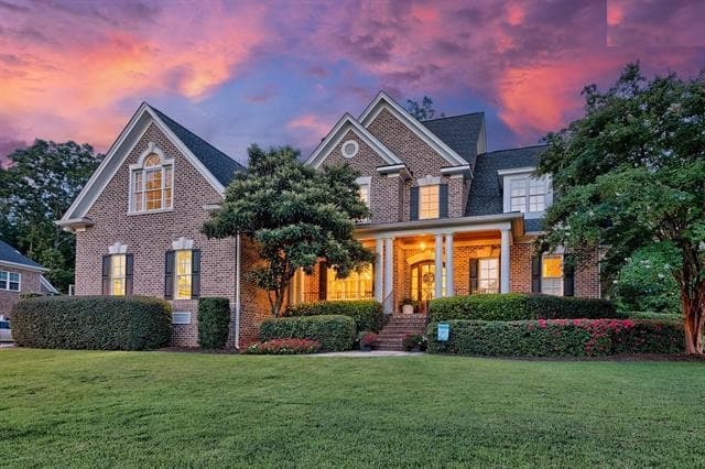 A brick Lexington, South Carolina house at sunset.