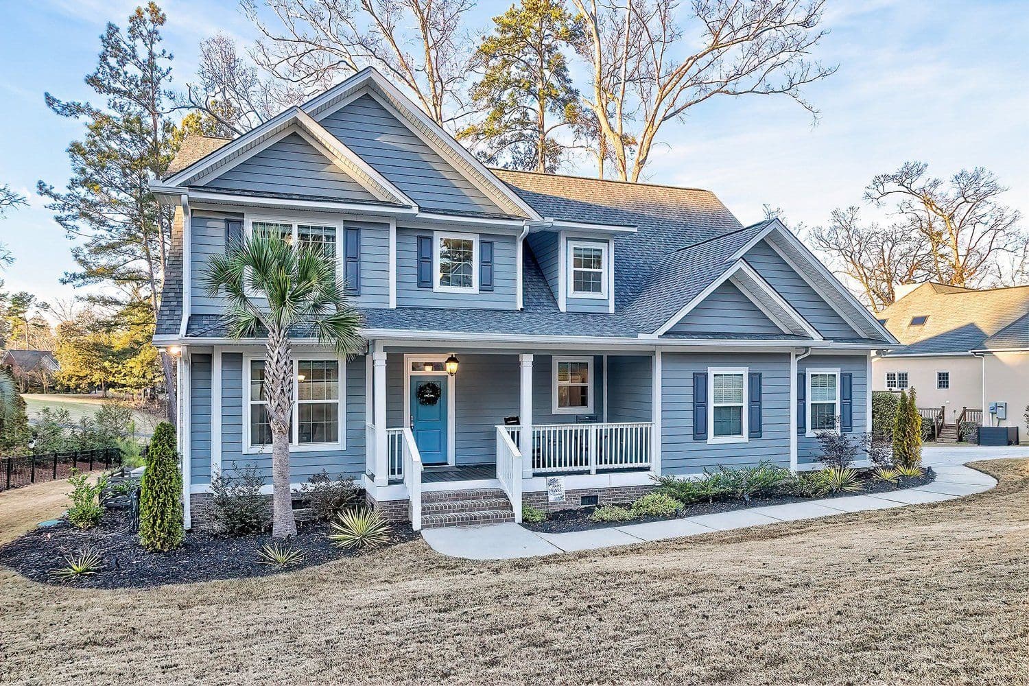 Blue two-story house with a front porch
