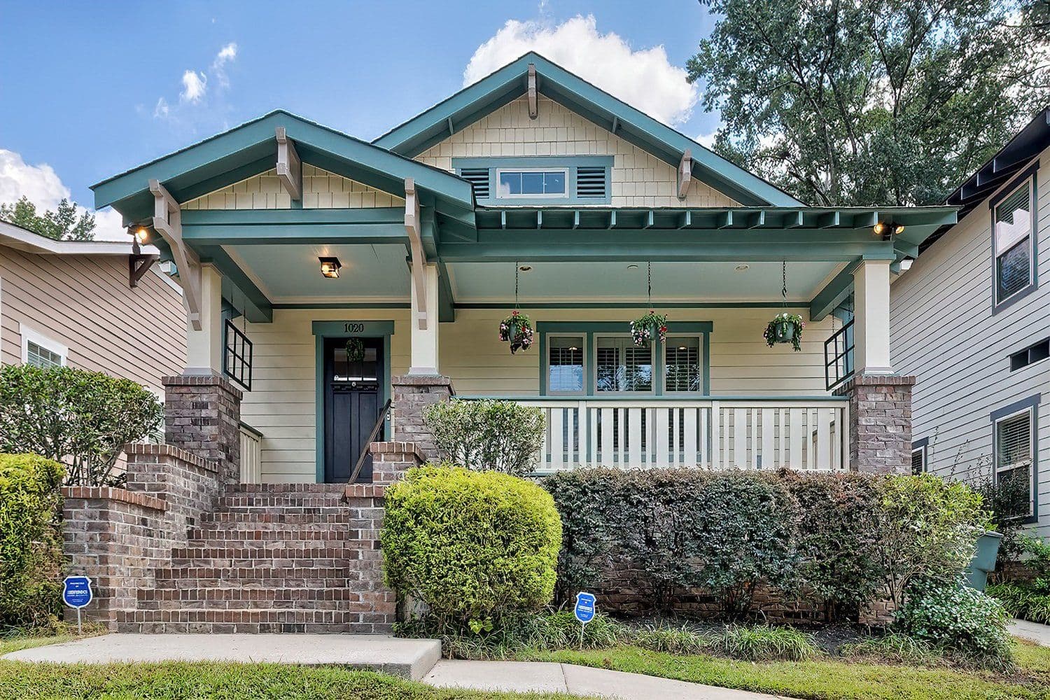 Green craftsman-style bungalow
