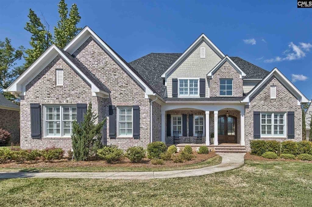 Home exterior with a manicured front lawn