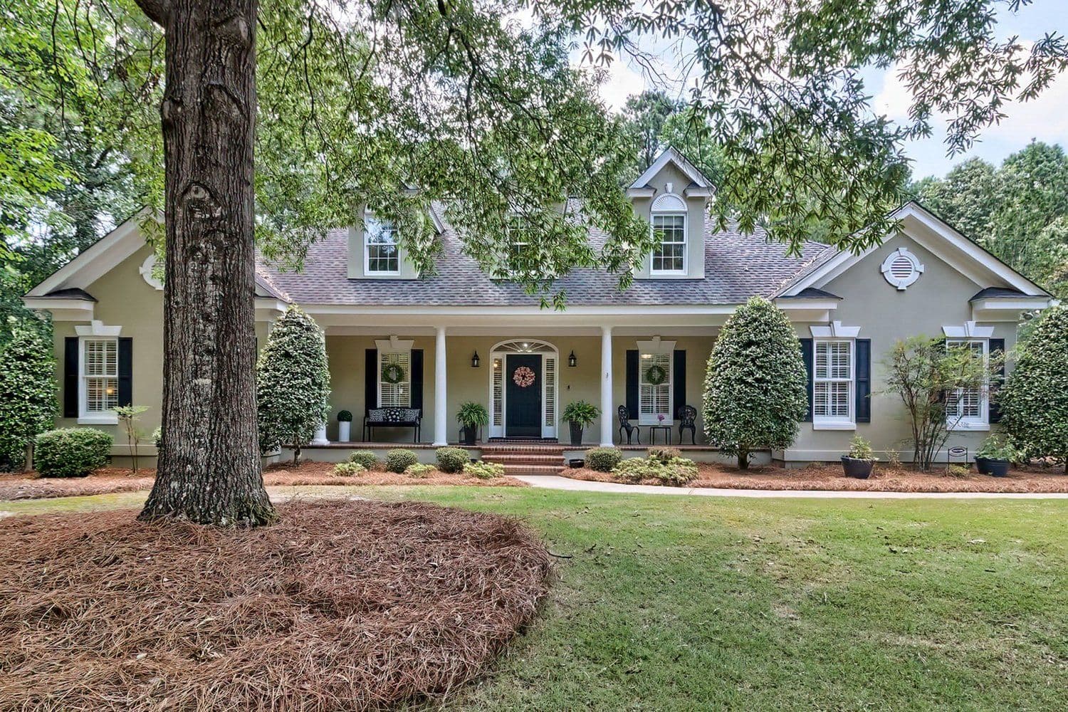 Long single-story home with a manicured front lawn