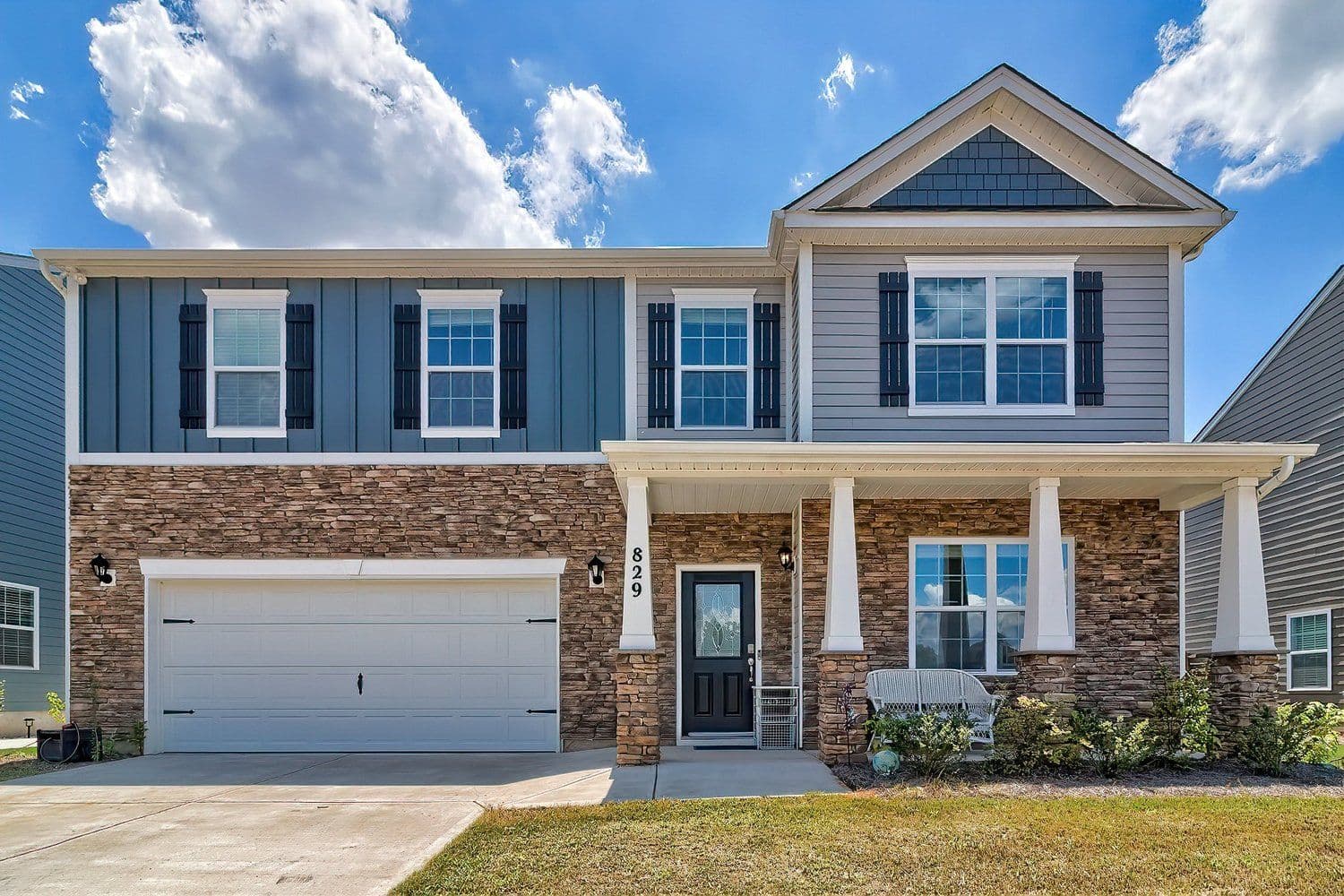 Modern two-story home with stone and siding