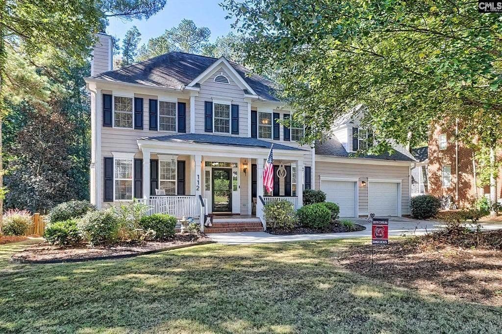 Two-story white house with black shutters