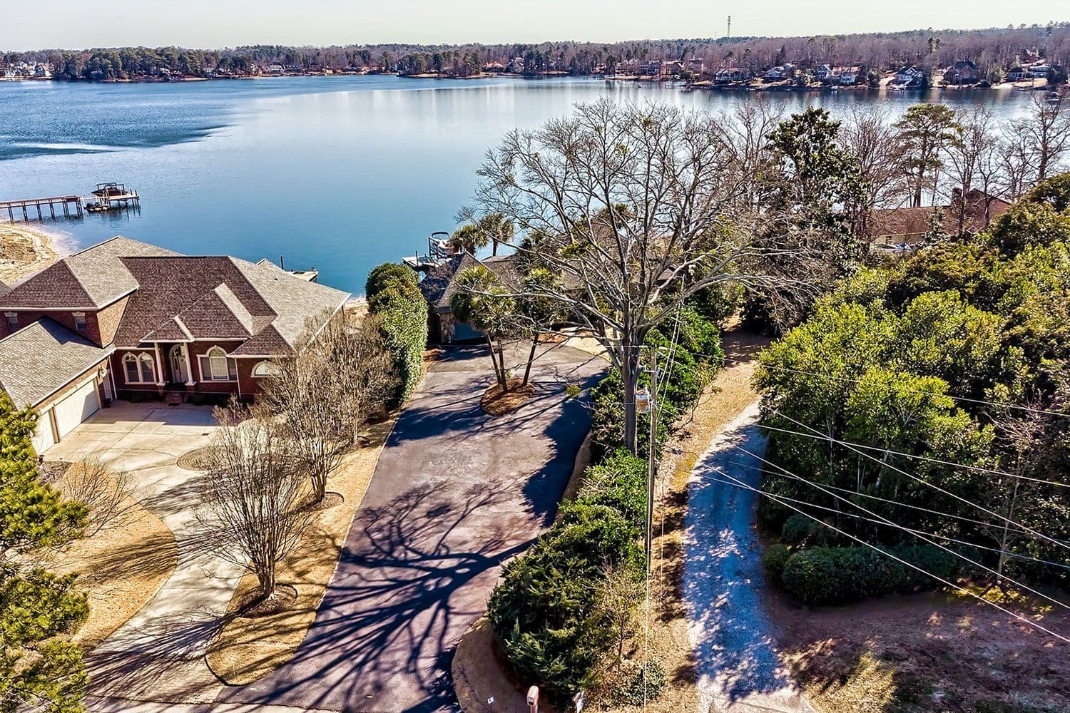 Aerial of a lake shoreline and residential neighborhood