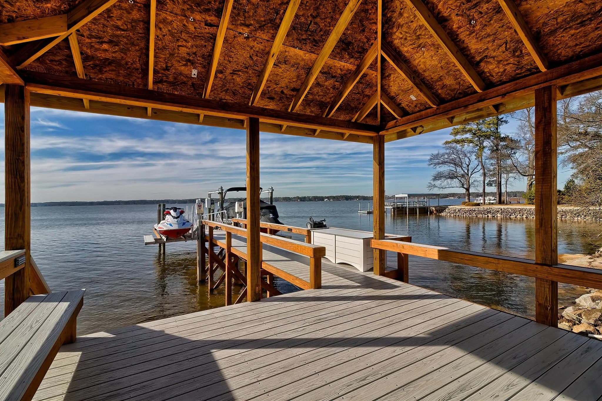 A covered dock looking out at the lake