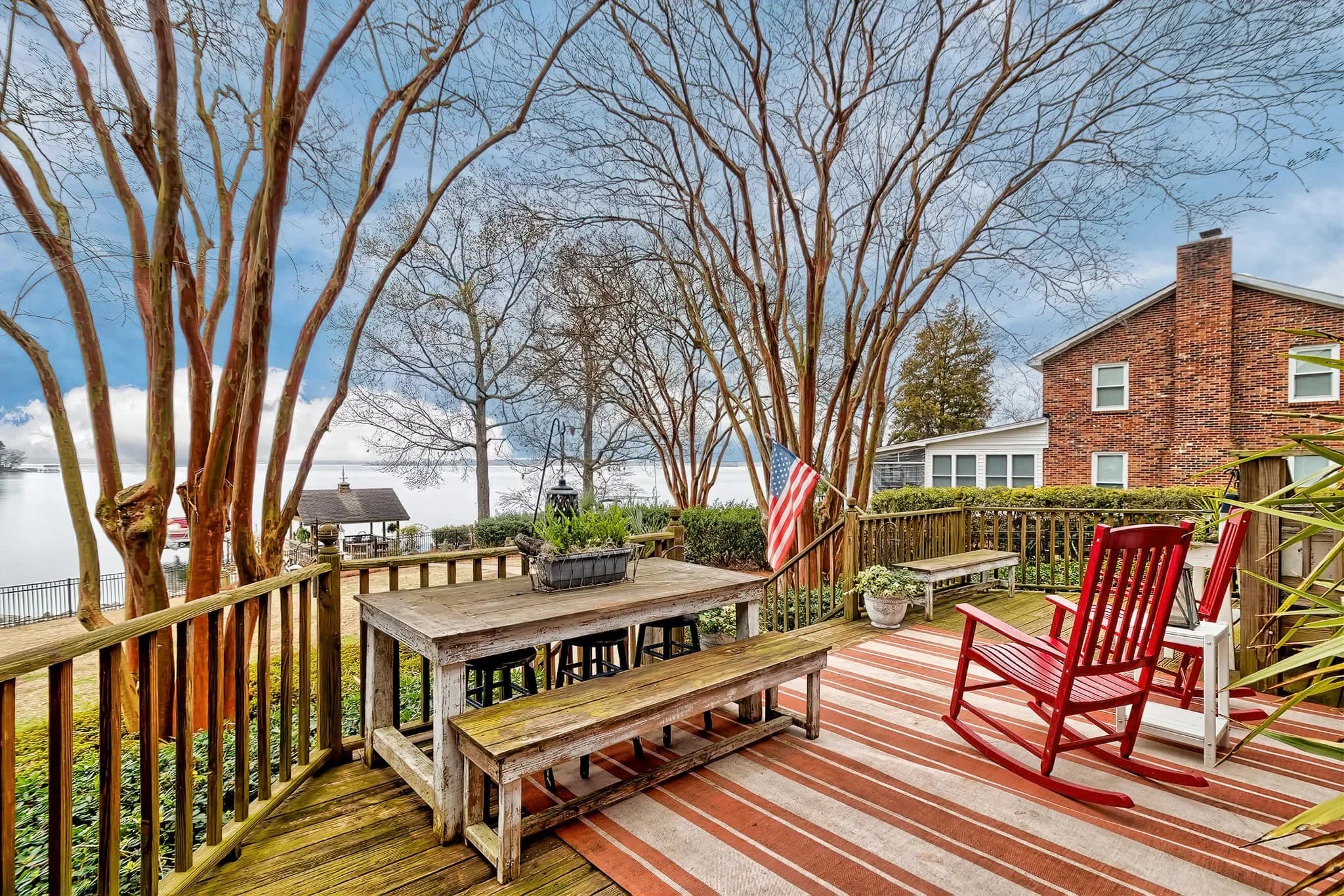 A wooden deck looking out at the lake