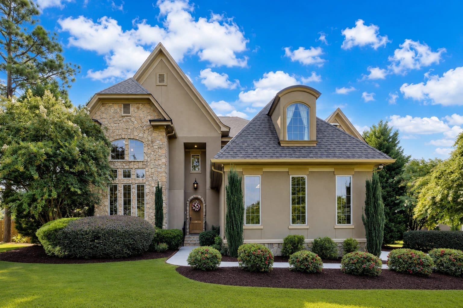 A contemporary house with stone and stucco